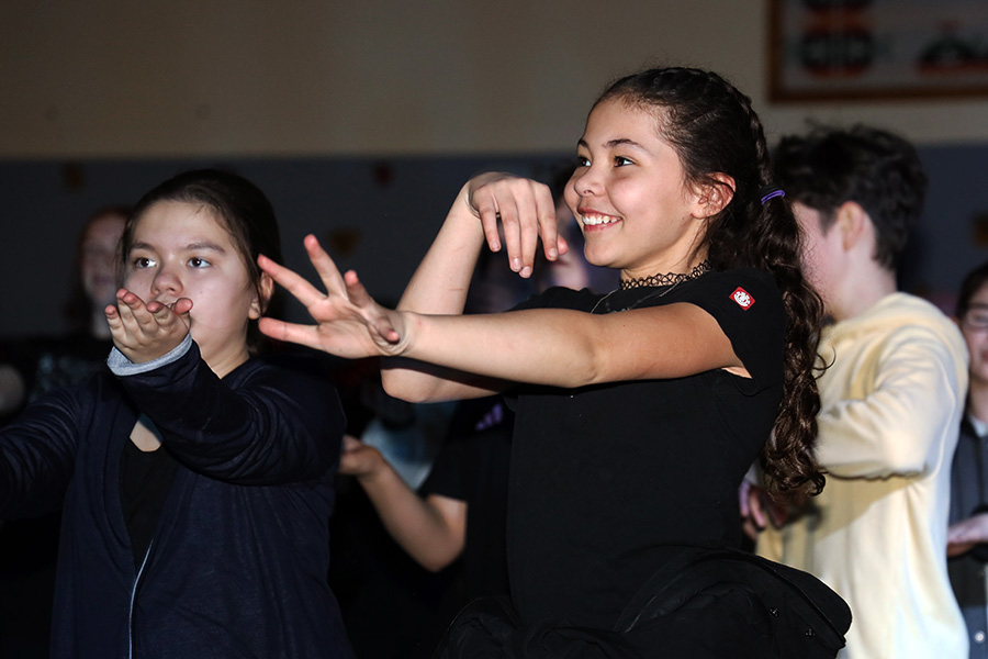 Image of two students dancing. 