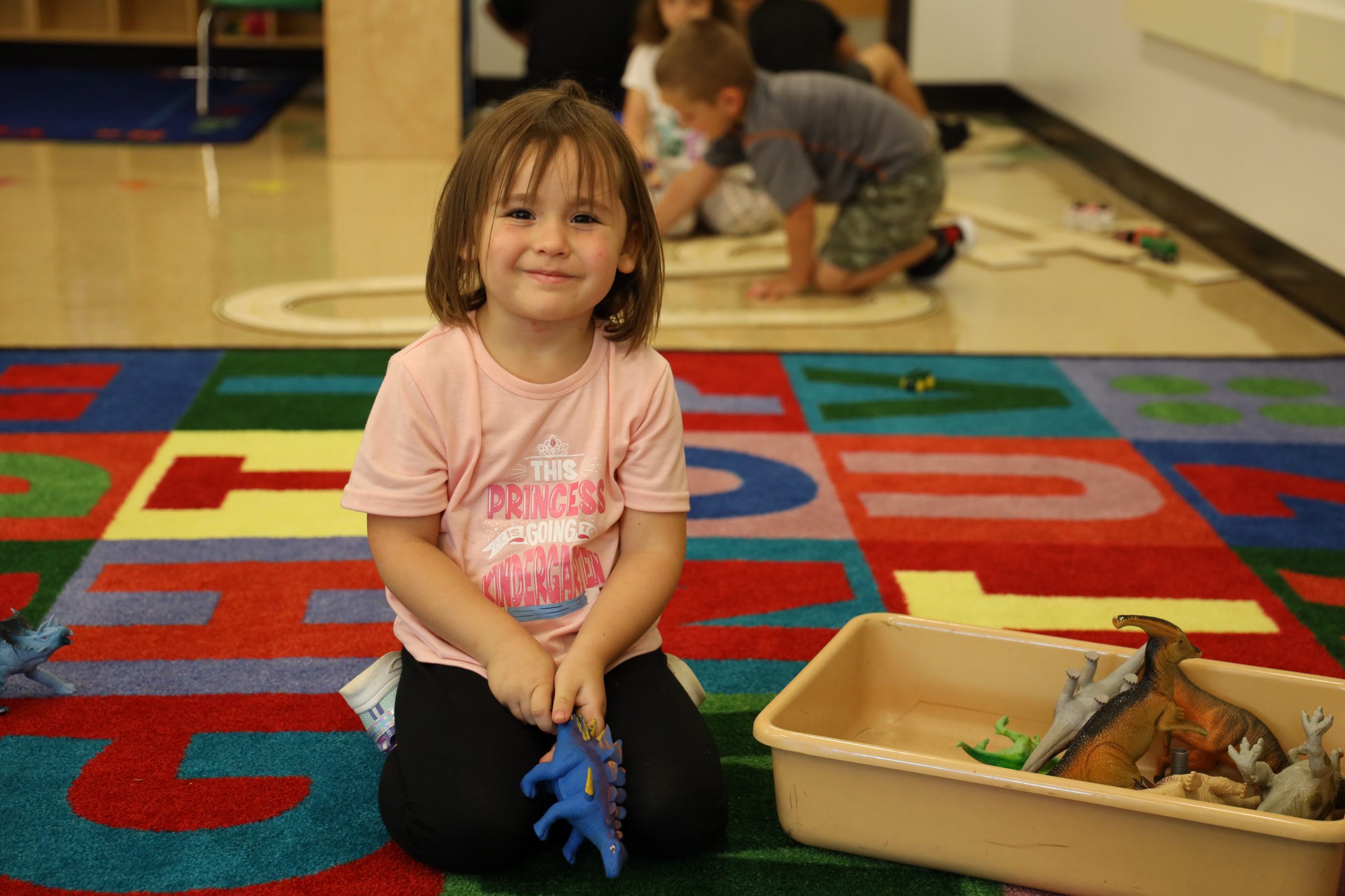 Image of student on classroom rug