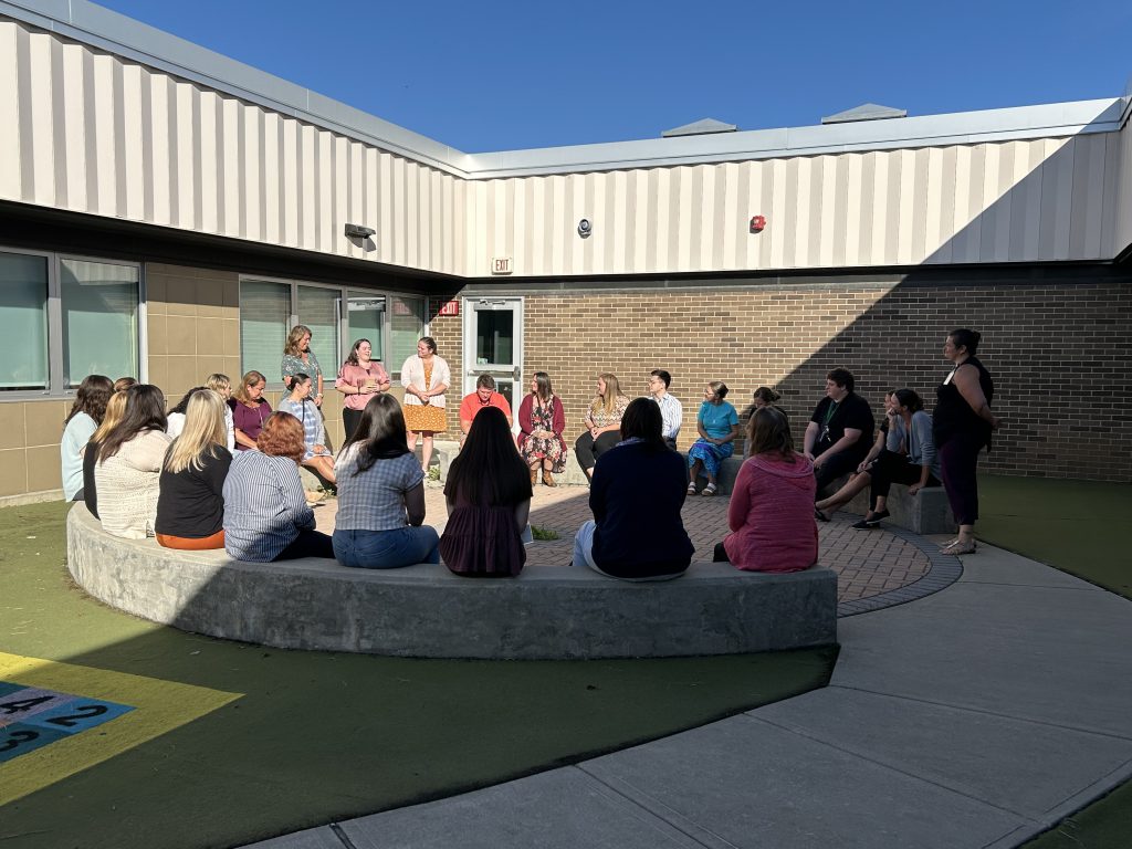 Group of adults sitting in circle formation