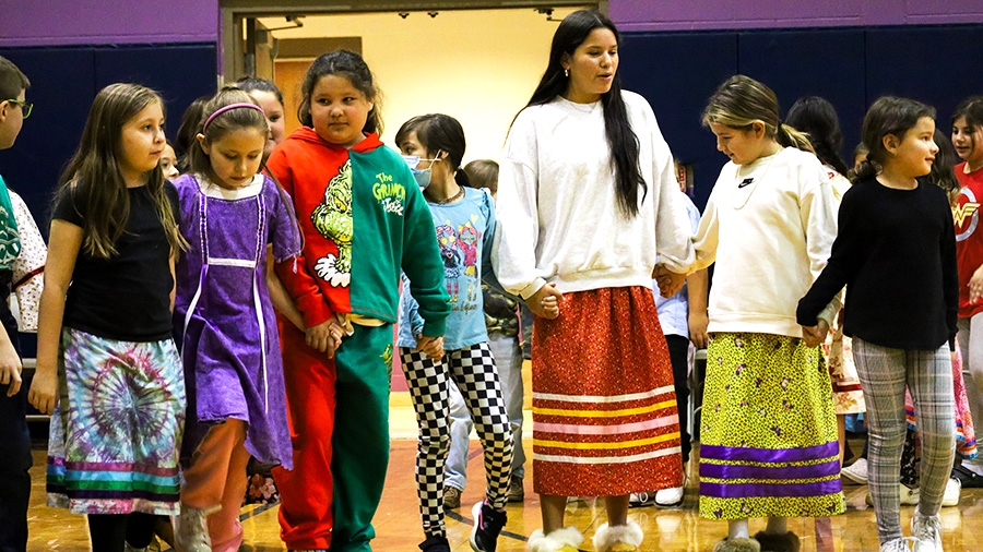 Image of students holding hands.