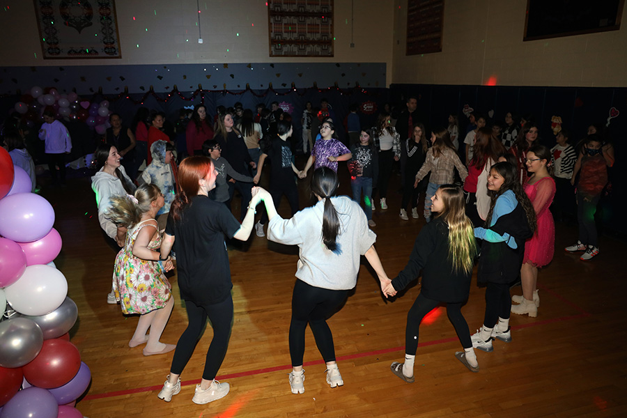 Image of dozens of students dancing.